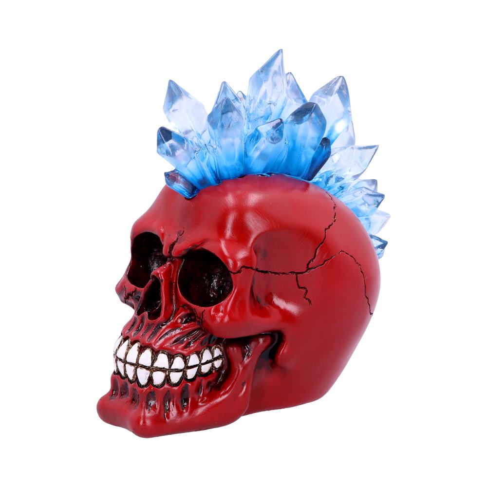 A side view of a red skull with blue mohawk. The hair is light in colour and looks like crystals sticking up in the air. There are cracks on the side of the head and the jaw sticks forward and is clenched into a grimace.