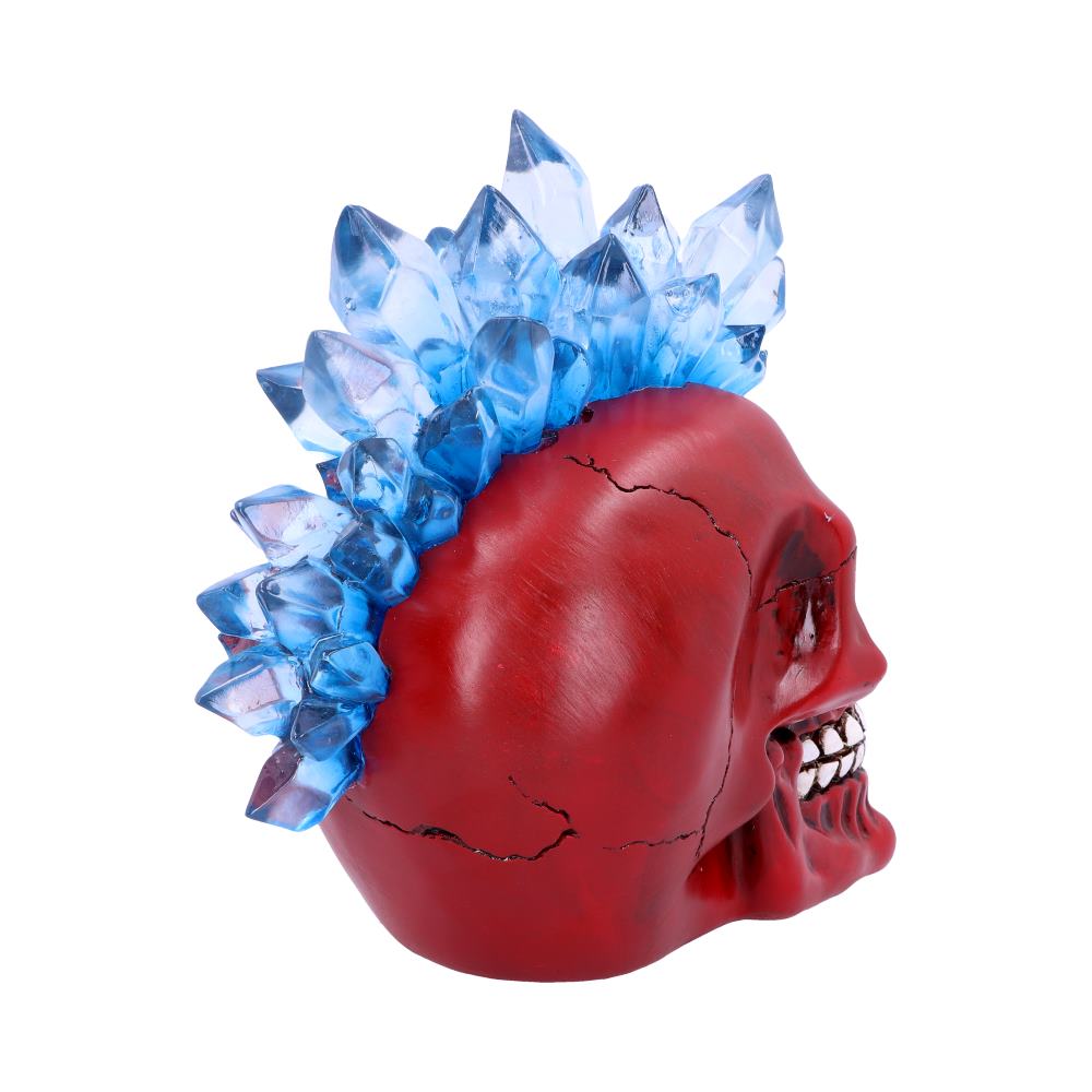 A red skull with the light reflecting off it is sitting angled so you can see the back more clearly. the skull has large cracks running around it and the light blue mohawk is shiny in appearance.