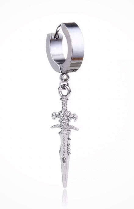 A side view of a earring that is in the shape of a small dagger attached to a sleeper hoop. It is silver coloured and lightweight to hold. The dagger has some intricate detailing including a hilt.