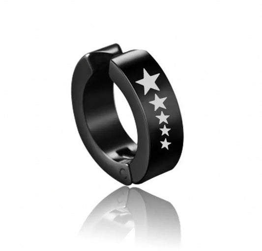 A black coloured ring shaped earring is on a plain white background. There are 5 white stars printed on the edge of it that start one size and get smaller as they go down. You can see the join in the item where you can open the earring to be able to clip onto a ear.