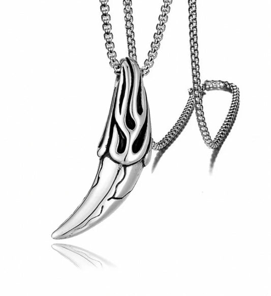 On a plain white background is a stainless steel silver coloured pendant in the shape of a wolf's fang. With a sturdy looking chain attached this item feels solid and weighty in the hand. 