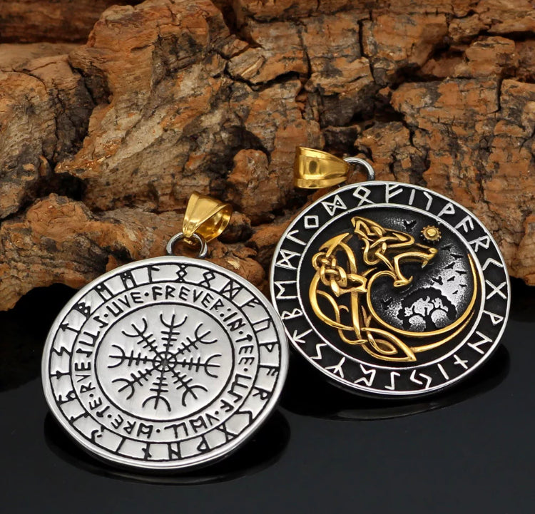 Leaning onto some wood are two pendants which are the same item but show the front and back of the item together. one is a silver helm of awe inscription and the other is of a gold wolf surrounded by silver runes around the edge. 