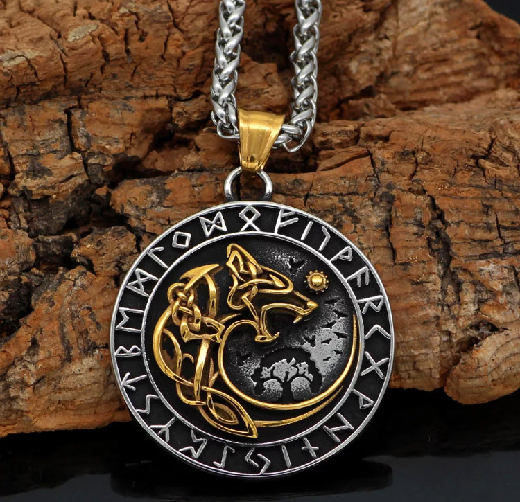 Leaning against a piece of wood is a stainless steel round pendant. On a quality solid chain this item has a gold wolf image on it with silvder runic symbols around the edge. When you hold the item you can feel the engravings under your fingers.