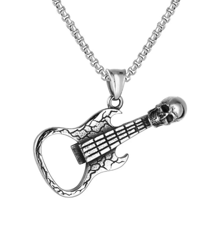 A necklace is attached to a guitar shaped pendant with the wide end being a bottle opener. The string end features a skull and the whole piece is silver in colour.