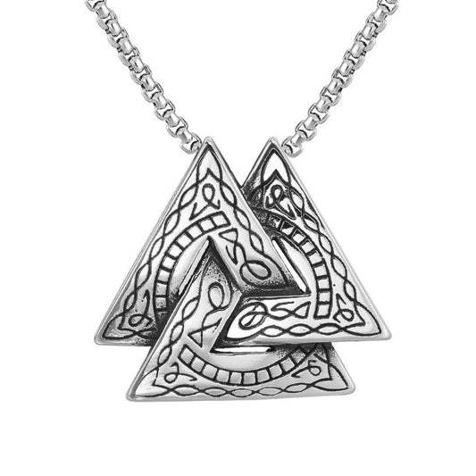 A silver coloured chain hangs on a white background. The pendant is three interlocking triangles in the style of a viking valknut. Threre is an etched pattern in black on the triangles.