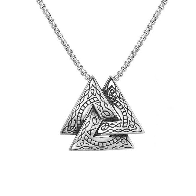 A silver coloured necklace hangs on a white background. The pendant is three interlocking triangles in the style of a viking valknut. Threre is an etched pattern in black on the triangles.